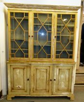 A 20thC pine dresser, painted in shabby chic pastel colours, the upperpart with three astragal