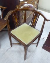 An Edwardian bone mahogany and marquetry  framed corner chair, raised on square, tapered legs