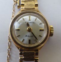 A lady's Everite 9ct gold cased bracelet wristwatch, faced by a baton dial