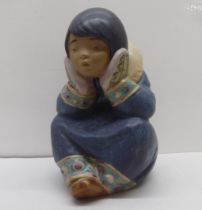 A Lladro matt finished porcelain Inuit figure  circa 1995  6"h