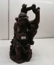 A 20thC carved hardwood figure, a seated Buddha with playful children  18"h