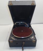 A vintage Colombia, No.201, portable gramophone, in a black fabric covered case; with a small