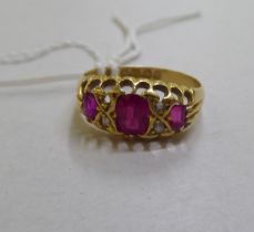 An 18ct gold diamond and ruby ring