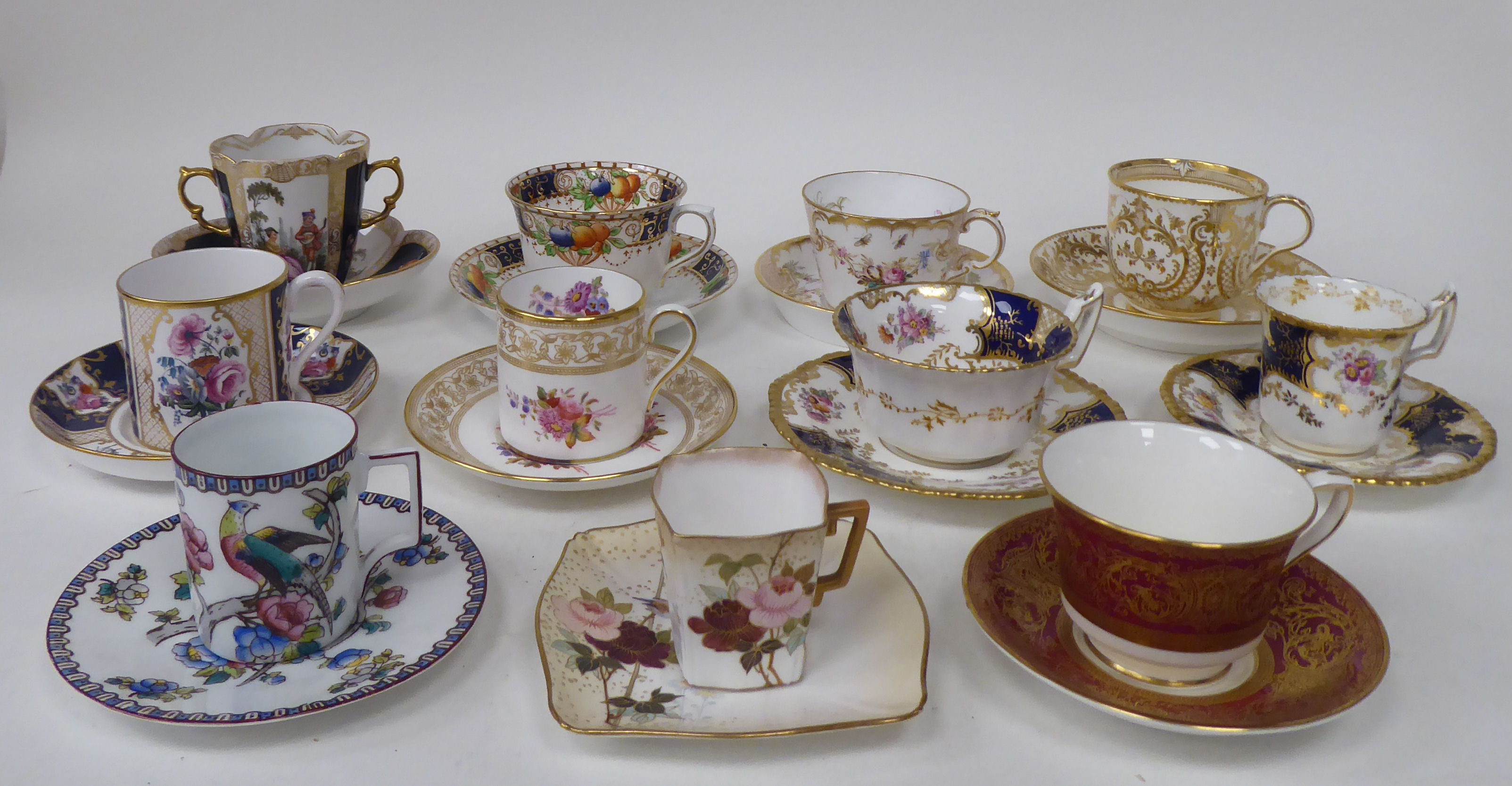 Eleven individual china cabinet cups and saucers: to include examples by Royal Worcester and