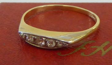 An 18ct gold five stone, rubover set diamond ring