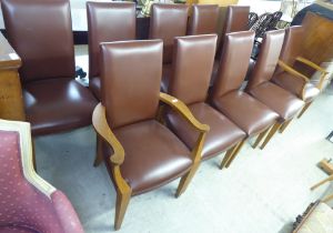 A set of ten modern brown hide dining chairs, raised on light oak square, tapered legs  comprising