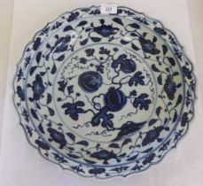 A 20thC Chinese porcelain Ming design charger, decorated with floral motifs  bears a six character