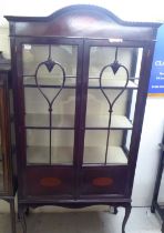 An Edwardian mahogany twin door display cabinet, raised on cabriole forelegs  70"h  36"w