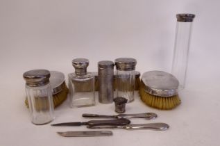 A gentleman's twelve piece, cut glass and silver mounted vanity set  comprising jars, hairbrushes