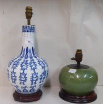 A modern Chinese porcelain table lamp of bottle vase form, decorated in blue and white with