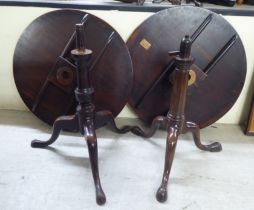 Two similar George III mahogany pedestal tables, each raised on a tripod base and pad feet  28"h
