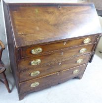 A George III string inlaid mahogany bureau, the fall flap over four graduated drawers, raised on