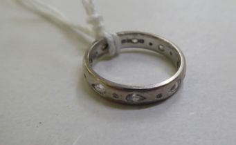 An 18ct white gold diamond set eternity ring