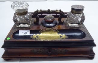 A mid 19thC brass inlaid mahogany deskstand, presented to the Rev. John Robertson by the members