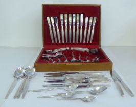 Community stainless steel flatware, in a light oak table top canteen  3" x 15"