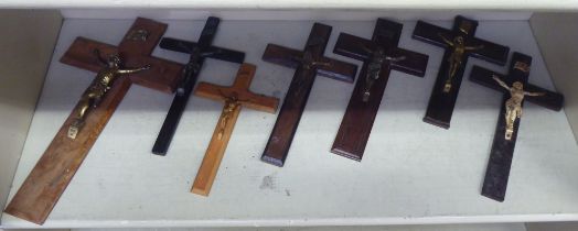 Seven similar wooden crucifix with variously cast metal Corpus Christi  largest 15"h