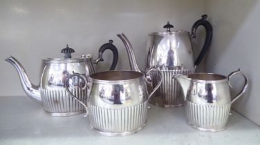 An early 20thC four piece silver plated tea set of round, demi-reeded form  comprising a teapot, a