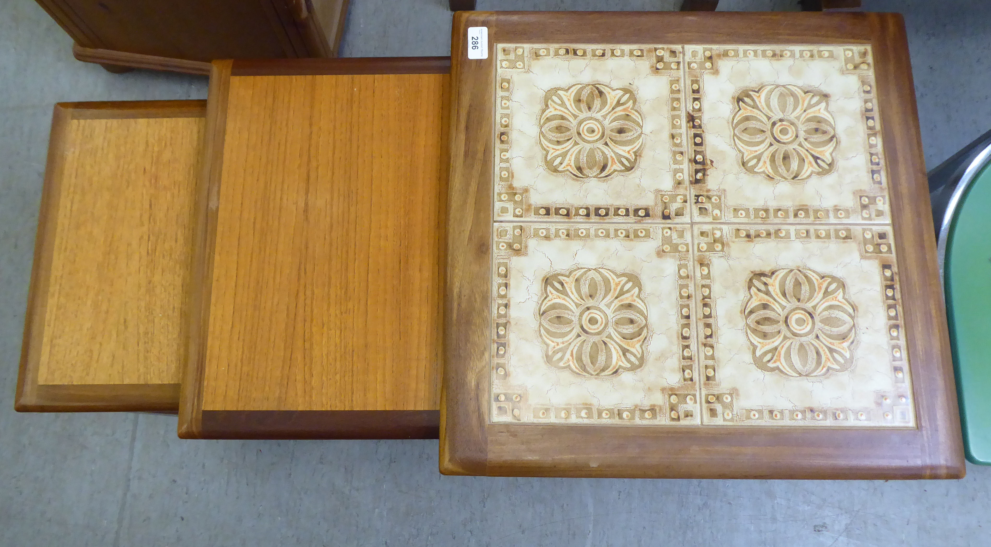 A nesting set of three G-Plan teak occasional tables, the largest top set with tiles, raised on - Image 2 of 5