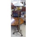 An early 20thC cast brass and wrought metal standard lamp  62"h