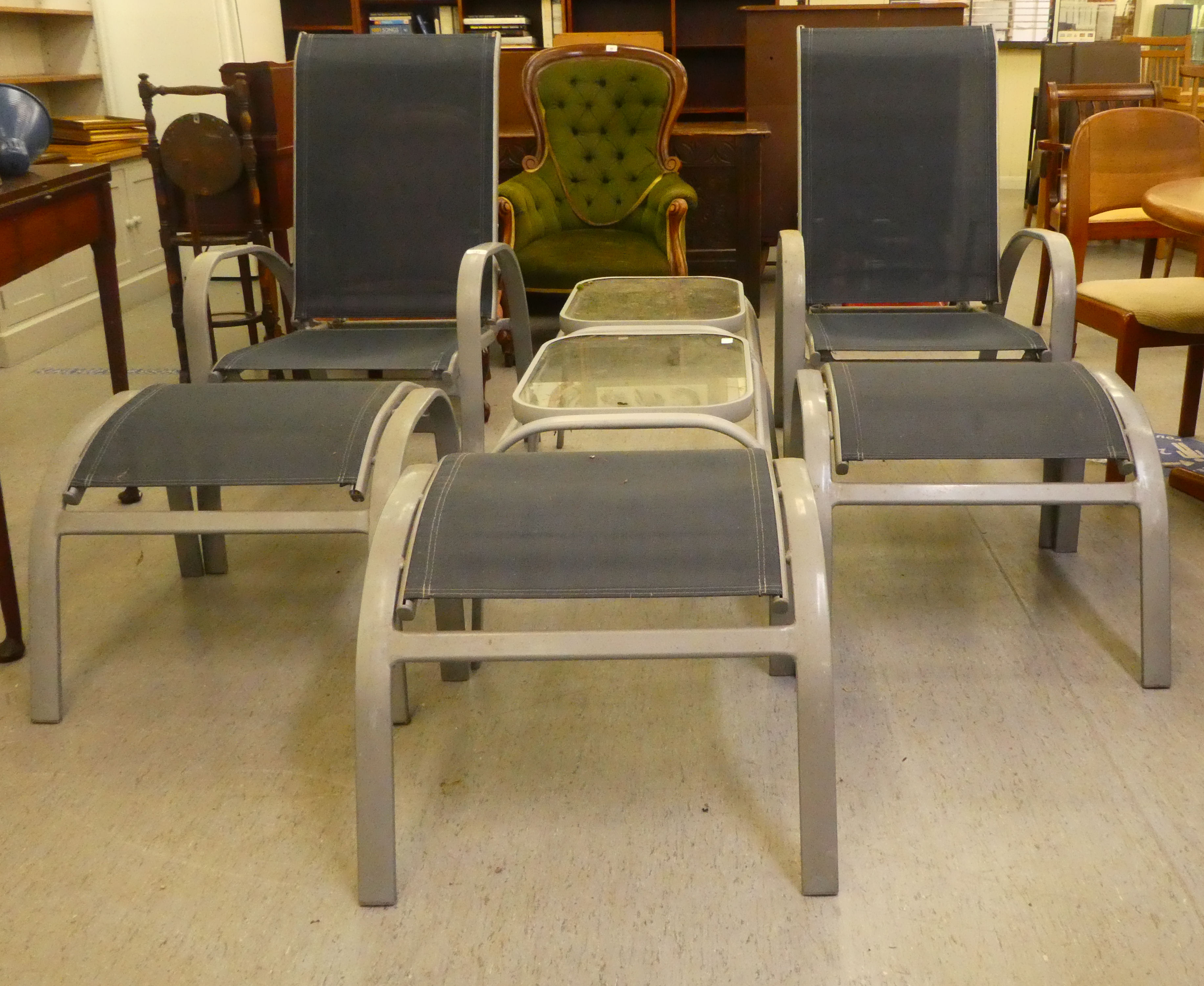 A pair of modern grey enamelled, alloy framed garden reclining, open arm chairs with fabric backs