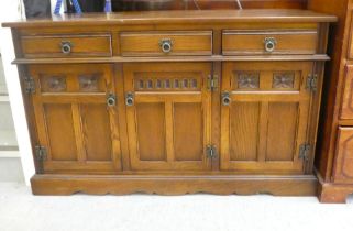 A Wood Bros Lancaster oak sideboard, comprising three drawers, over three cupboard doors, raised