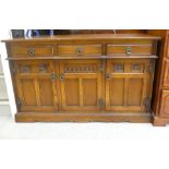 A Wood Bros Lancaster oak sideboard, comprising three drawers, over three cupboard doors, raised