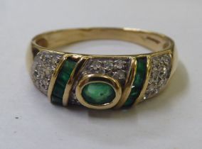 A 9ct gold emerald and diamond set ring