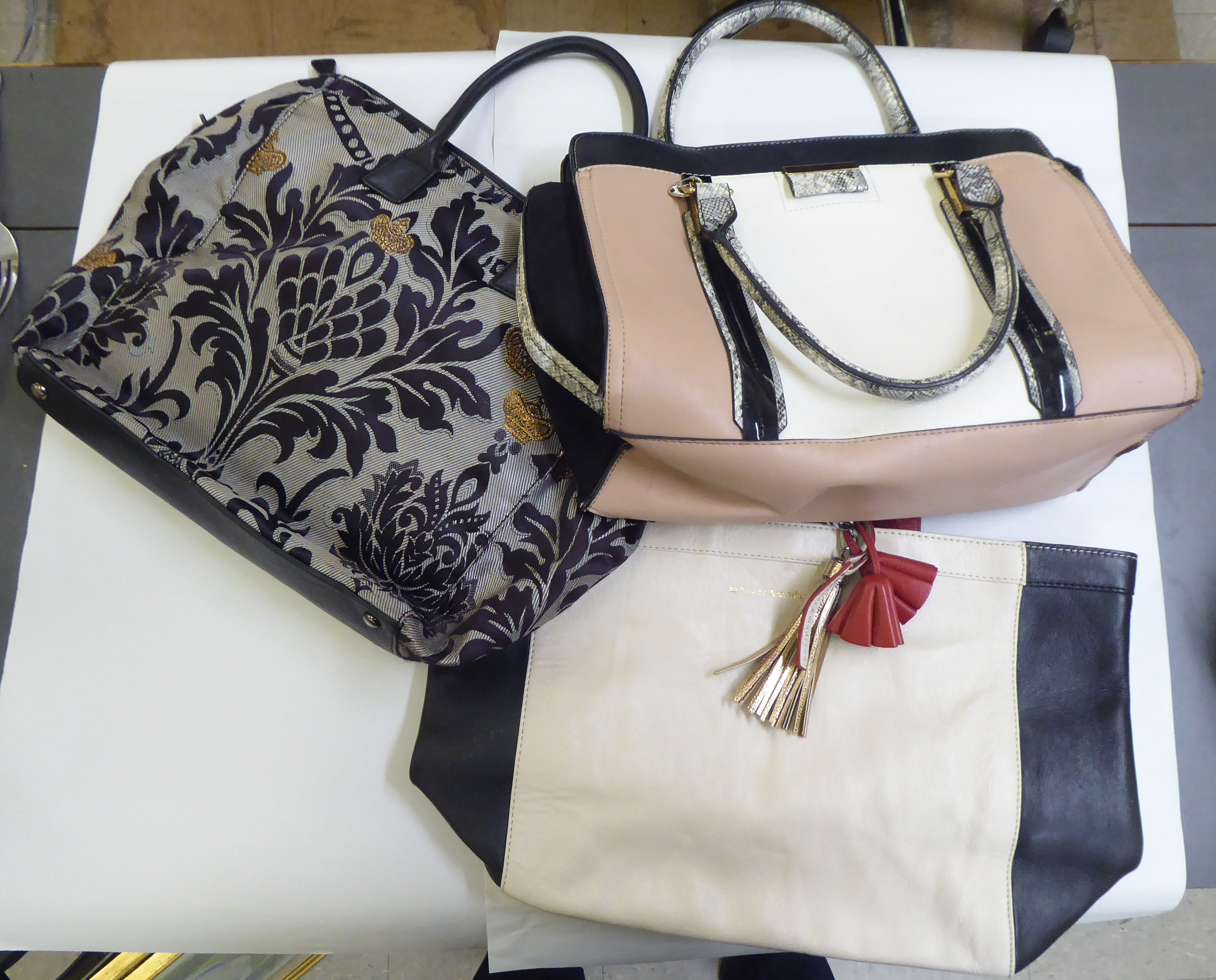 Three ladies handbags: to include a black and cream stitched leather Mercer & Madison example