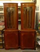 A pair of modern mahogany veneered, glazed corner cabinets  71"h  25"w