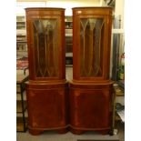 A pair of modern mahogany veneered, glazed corner cabinets  71"h  25"w