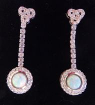 A pair of silver coloured metal, opal set drop earrings