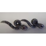 A pair of silver coloured metal and marcasite, snake design earrings with ruby eyes