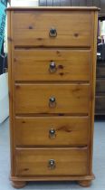 A modern waxed pine, five drawer tallboy with drop handles  40"h  19"w