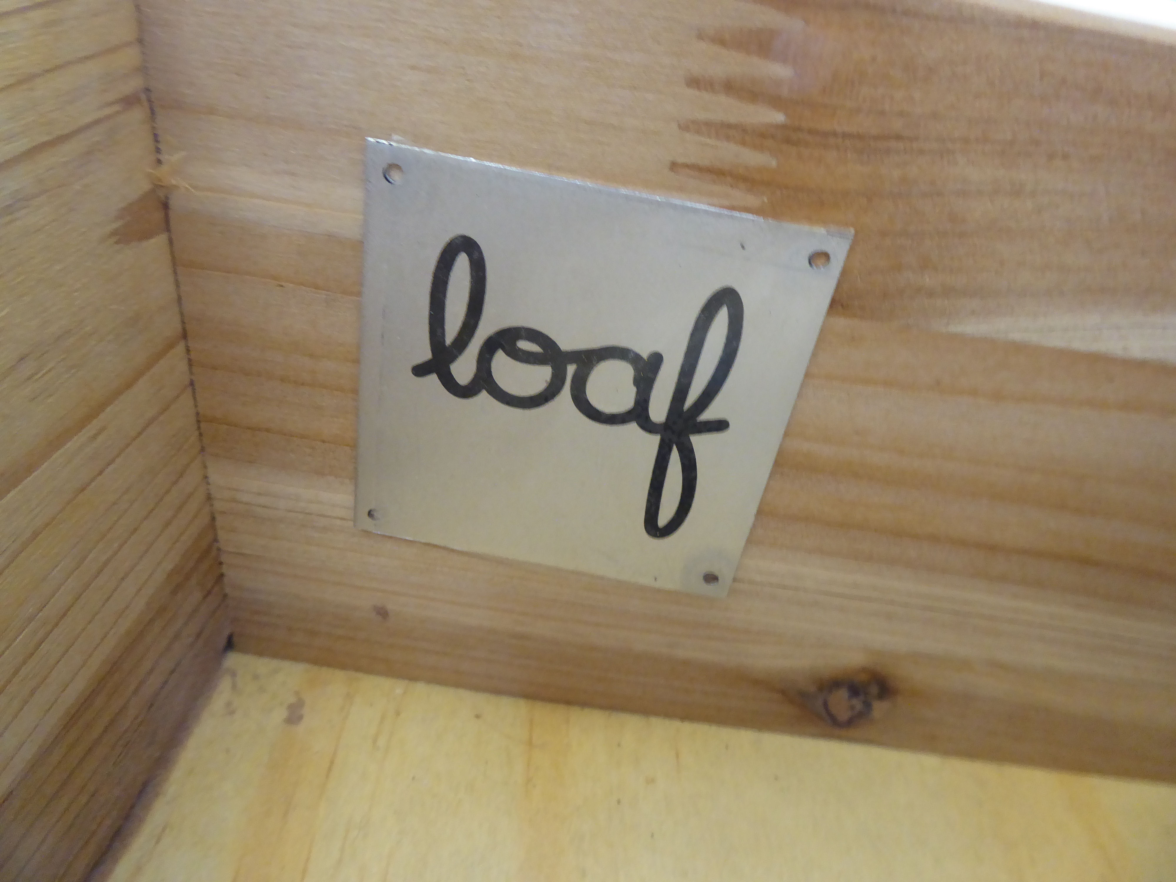 A Loaf steel framed and stained fir sideboard with four frieze drawers, over two open shelves, - Image 3 of 3