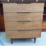 A 1960s/70s teak dressing chest with four drawers, raised on turned, tapered legs  40"h  34"w