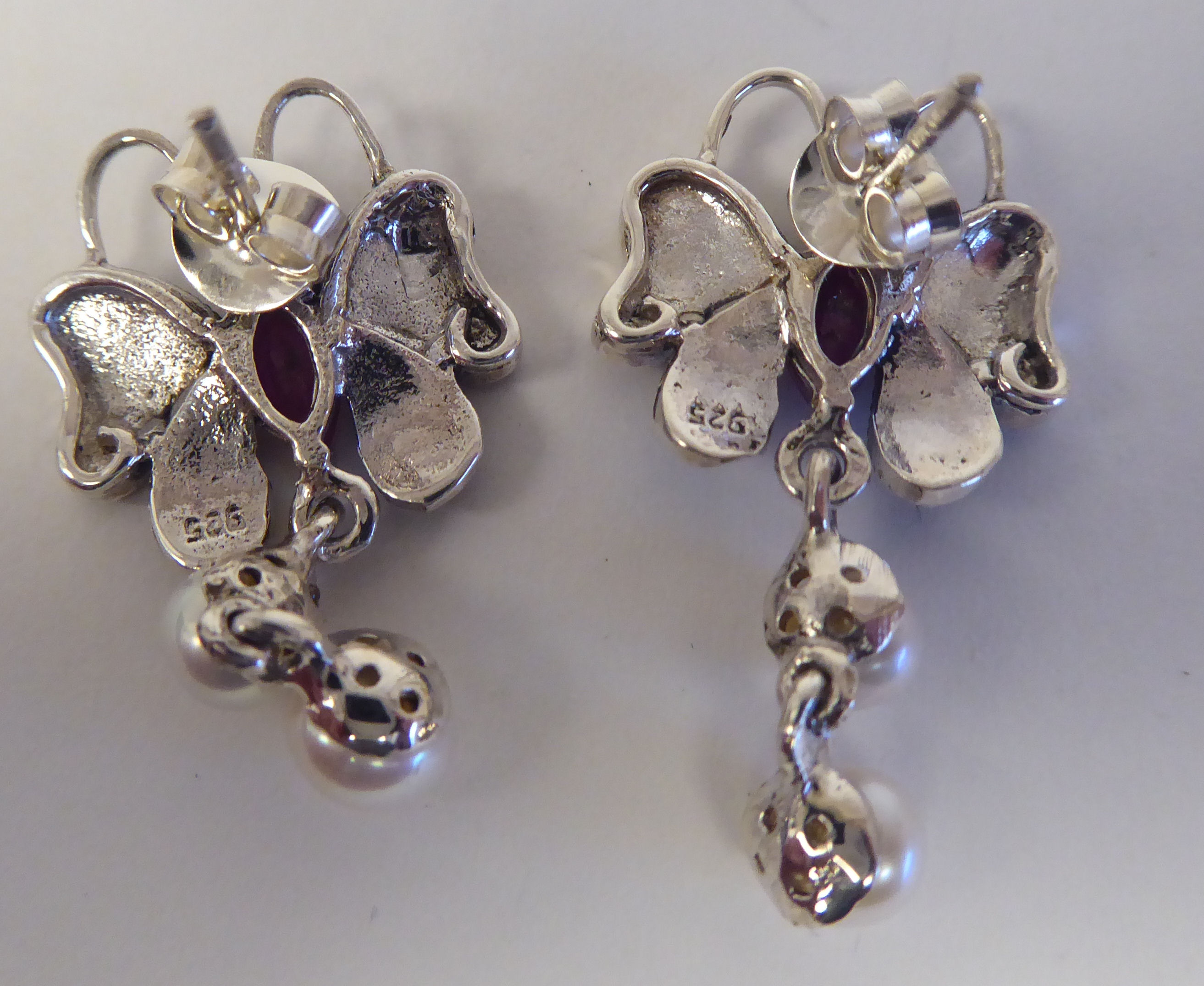 A pair of silver coloured metal and ruby set, butterfly design stud earrings - Image 2 of 2