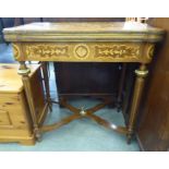 An early 20thC Continental inspired marquetry and kingwood veneered writing table, the hinged top