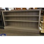 A modern grey painted pine, open front dwarf bookcase, on a plinth  33.5"h  60"w