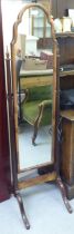 An Edwardian mahogany framed cheval mirror, raised on splayed legs  62"h  16"w