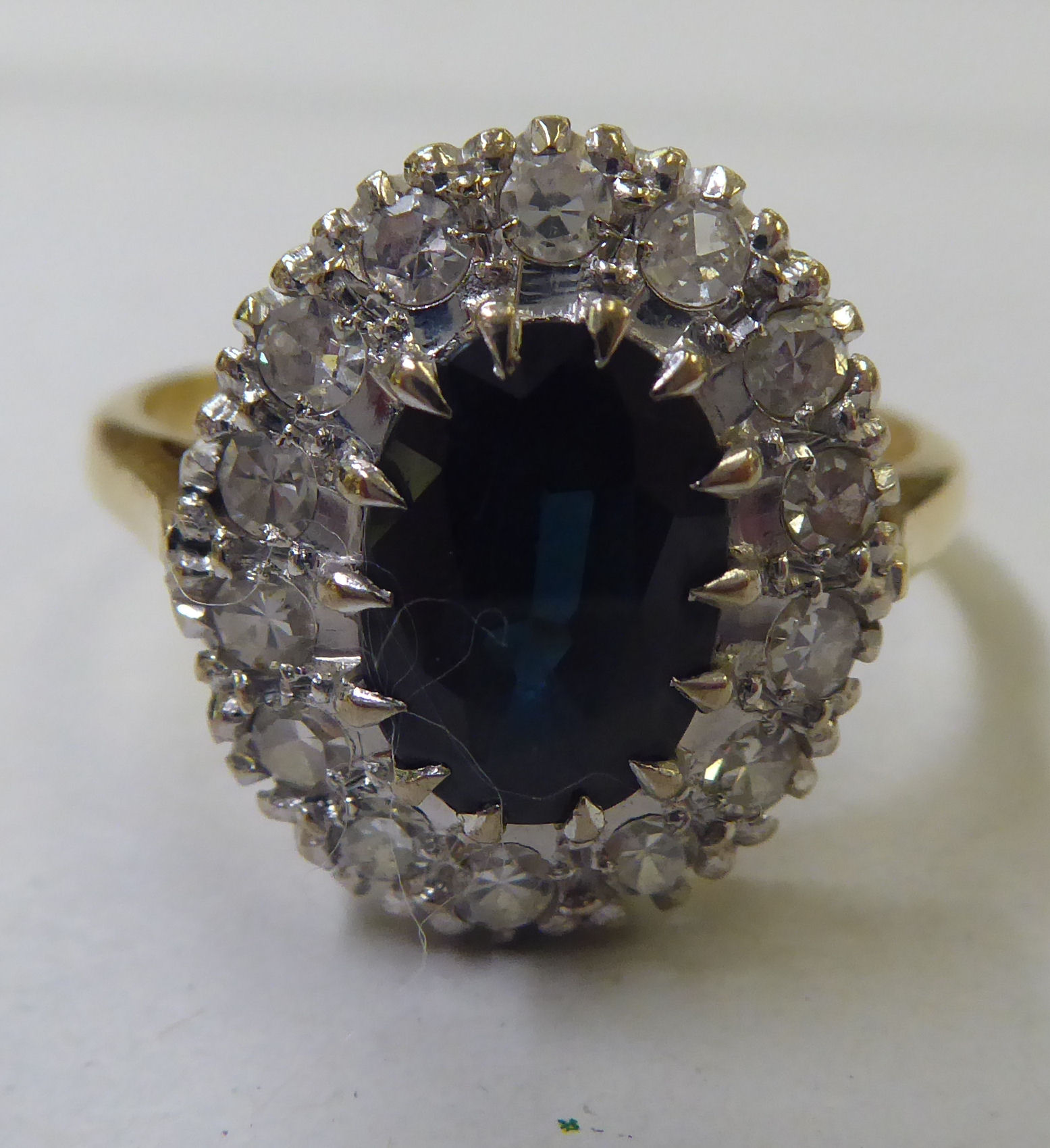 An 18ct gold diamond and sapphire cluster ring