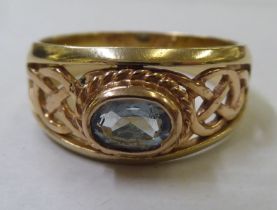 A 9ct gold ring with an unidentified blue stone