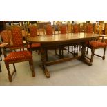 A Wood Bros Old Charm oak dining table, the oval top raised over a turned wooden base, united by a