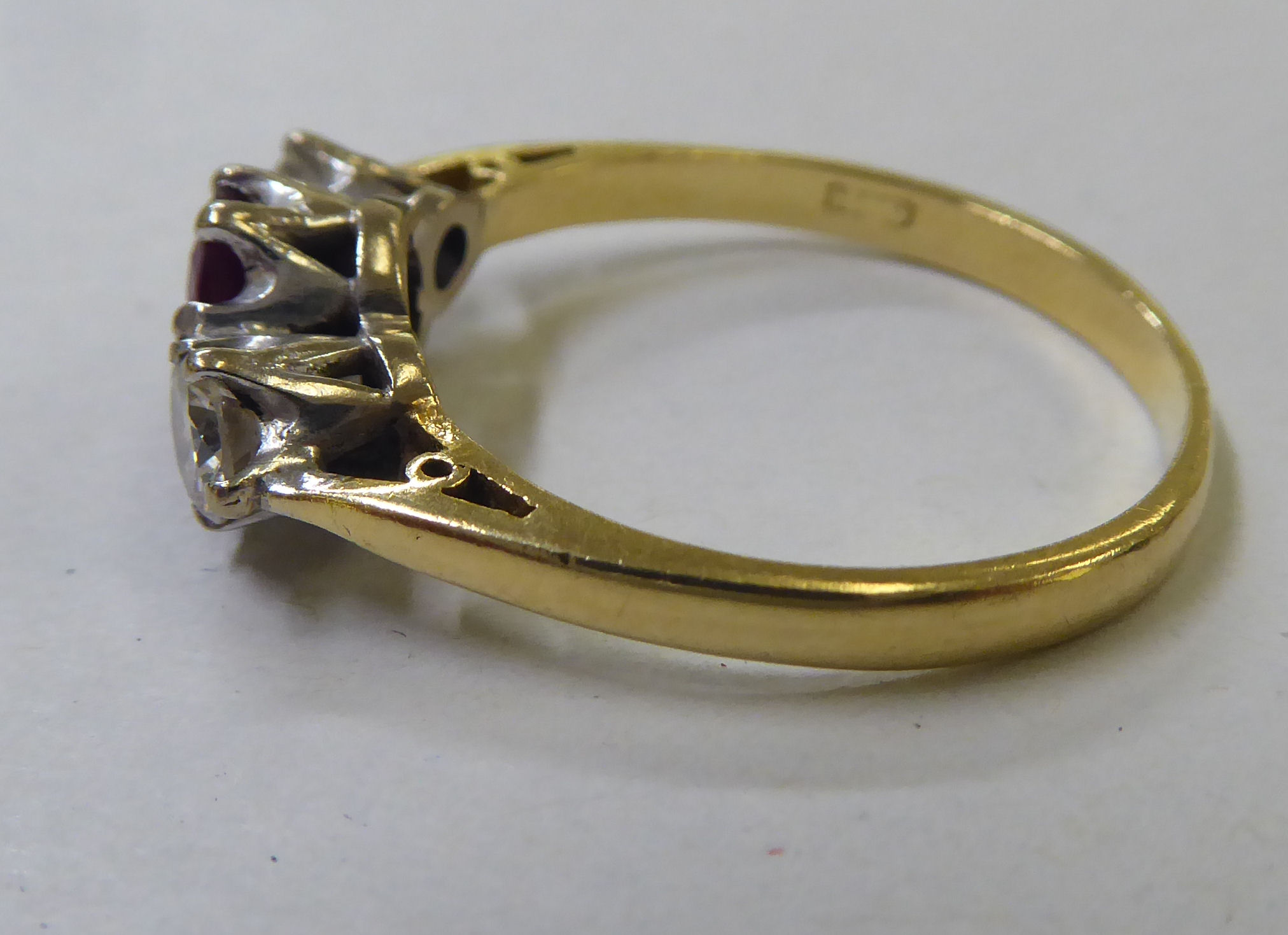 An 18ct gold ring, claw set with a central ruby, flanked by two diamonds - Image 2 of 4