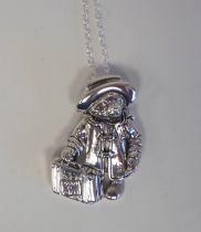 A silver coloured metal Paddington Bear pendant, on a fine neckchain and dog clip  stamped Sterling