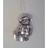 A silver coloured metal Paddington Bear pendant, on a fine neckchain and dog clip  stamped Sterling