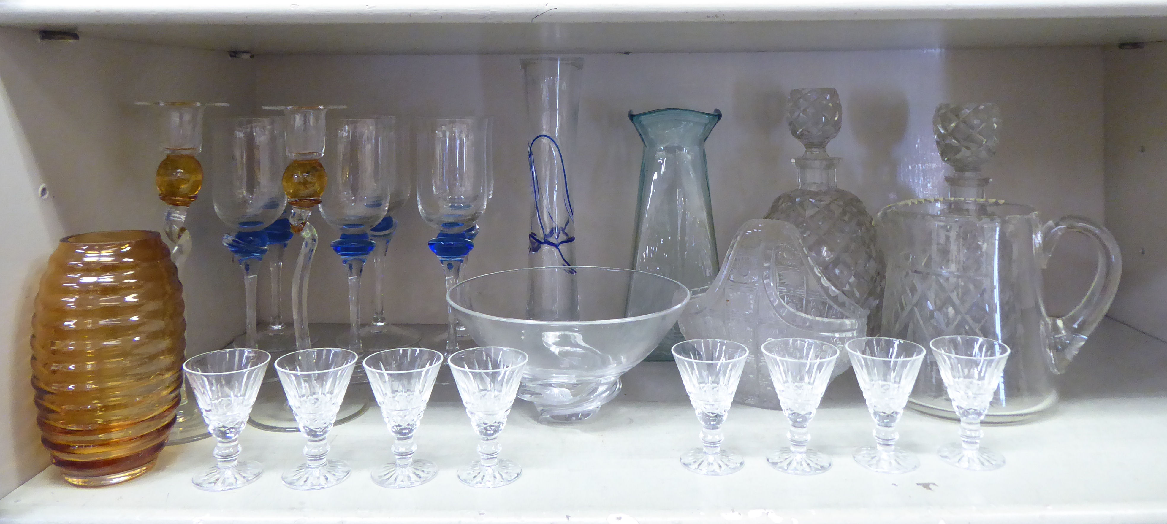 Coloured and clear glassware: to include two bulbous cut glass decanters with stoppers; and a set of