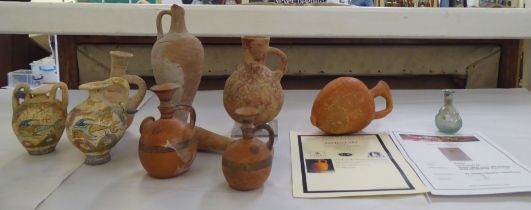 Roman and similar pottery and glass vessels: to include a glass bottle vase from the 2nd Century AD