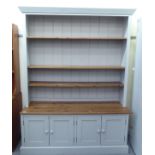 A modern grey painted and honey coloured pine two-part dresser, the superstructure with three height