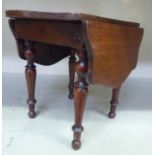 A 19thC mahogany apprentice piece Pembroke table with butterfly fall flaps, raised on ring turned