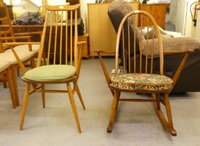 An Ercol honey coloured beech and elm framed, high hoop and spindled back, open arm rocking chair